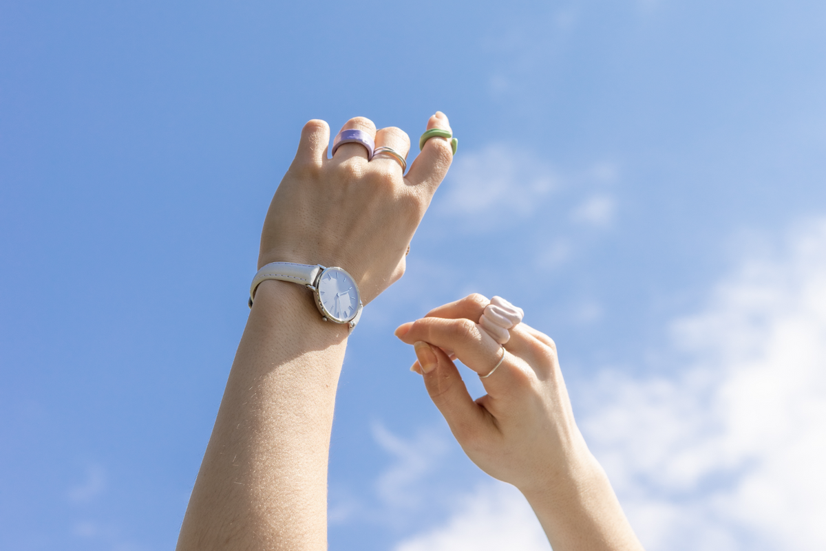 women hands pointing to the sky